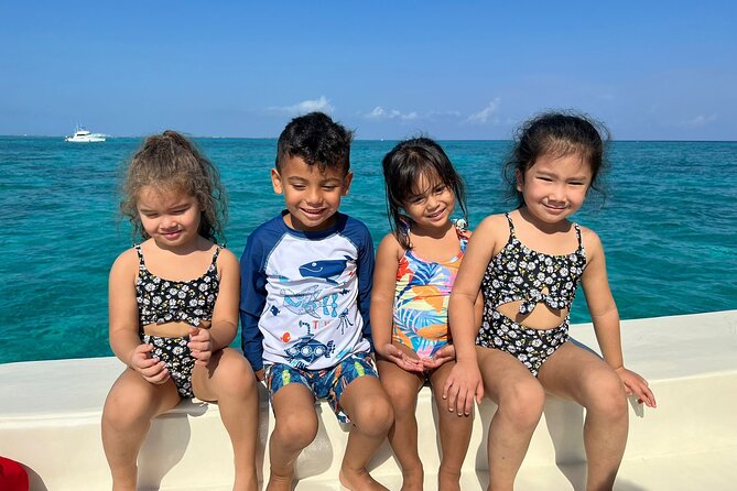 Avoid the crowd book your Private Stingraycity Charter today - Stingray City in three feet of water
