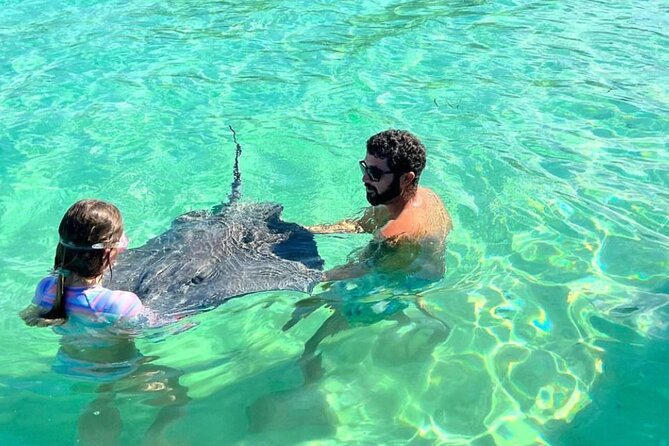 Stingray City and Snorkeling Private Charter - Searching the seagrass for starfish